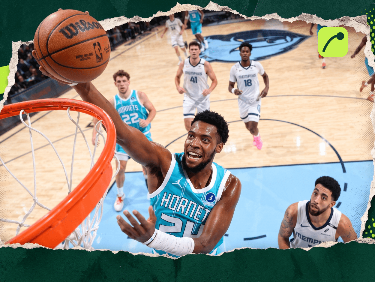 Charlotte Hornets forward Brandon Miller drives for a layup against Memphis Grizzlies defenders