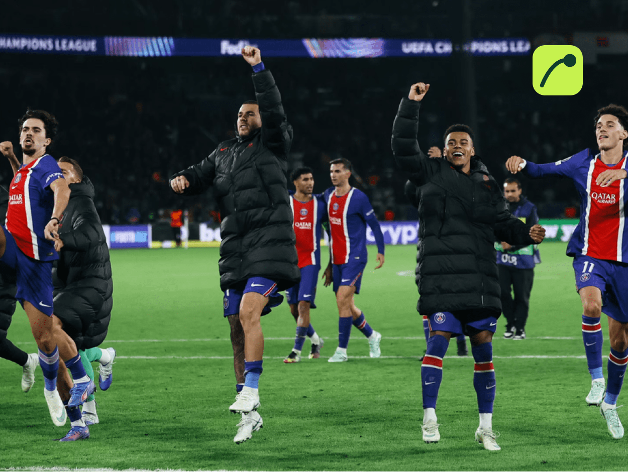 Paris Saint-Germain players celebrating a late Champions League goal against Barcelona